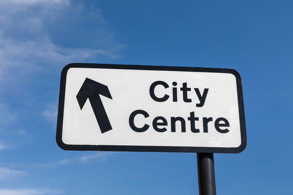 A directional arrow sign guiding guests at an event