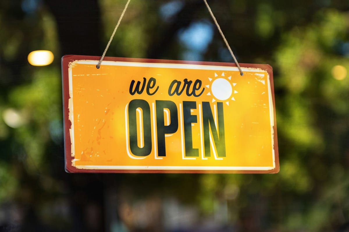 A printed sign in full sun outdoors