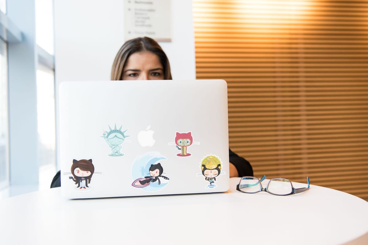 Applying a matte vinyl sticker to a laptop