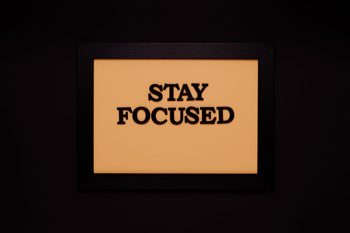 Framed posters of different sizes on a wall