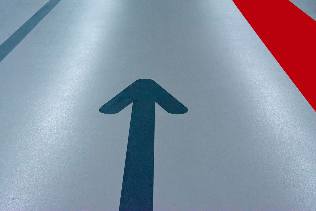 An arrow floor decal on a polished floor