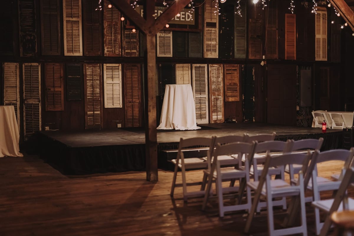 A large stage backdrop behind a conference stage