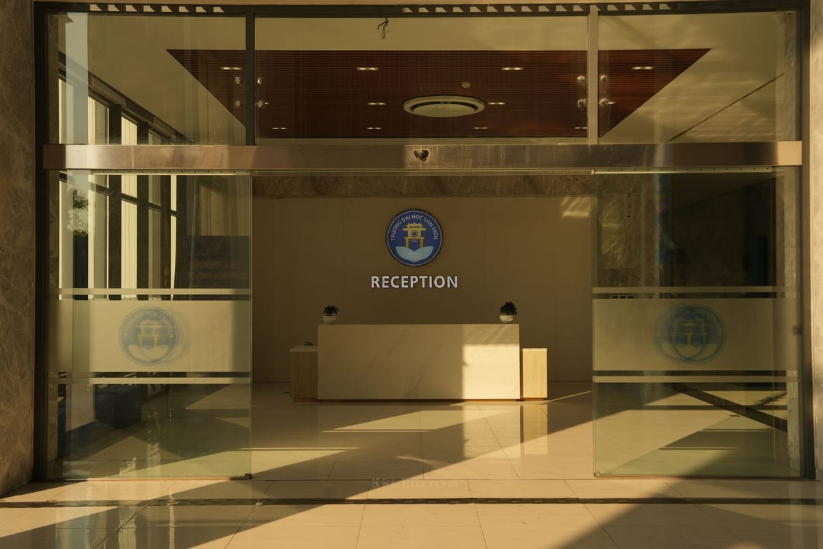 An etched-glass effect logo on a glass door