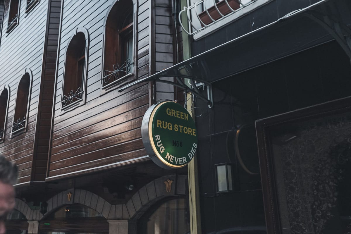 A storefront sign on a shop façade