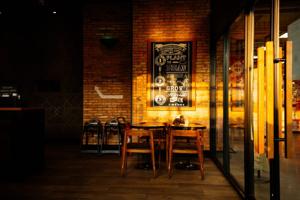 A printed menu board on a café wall
