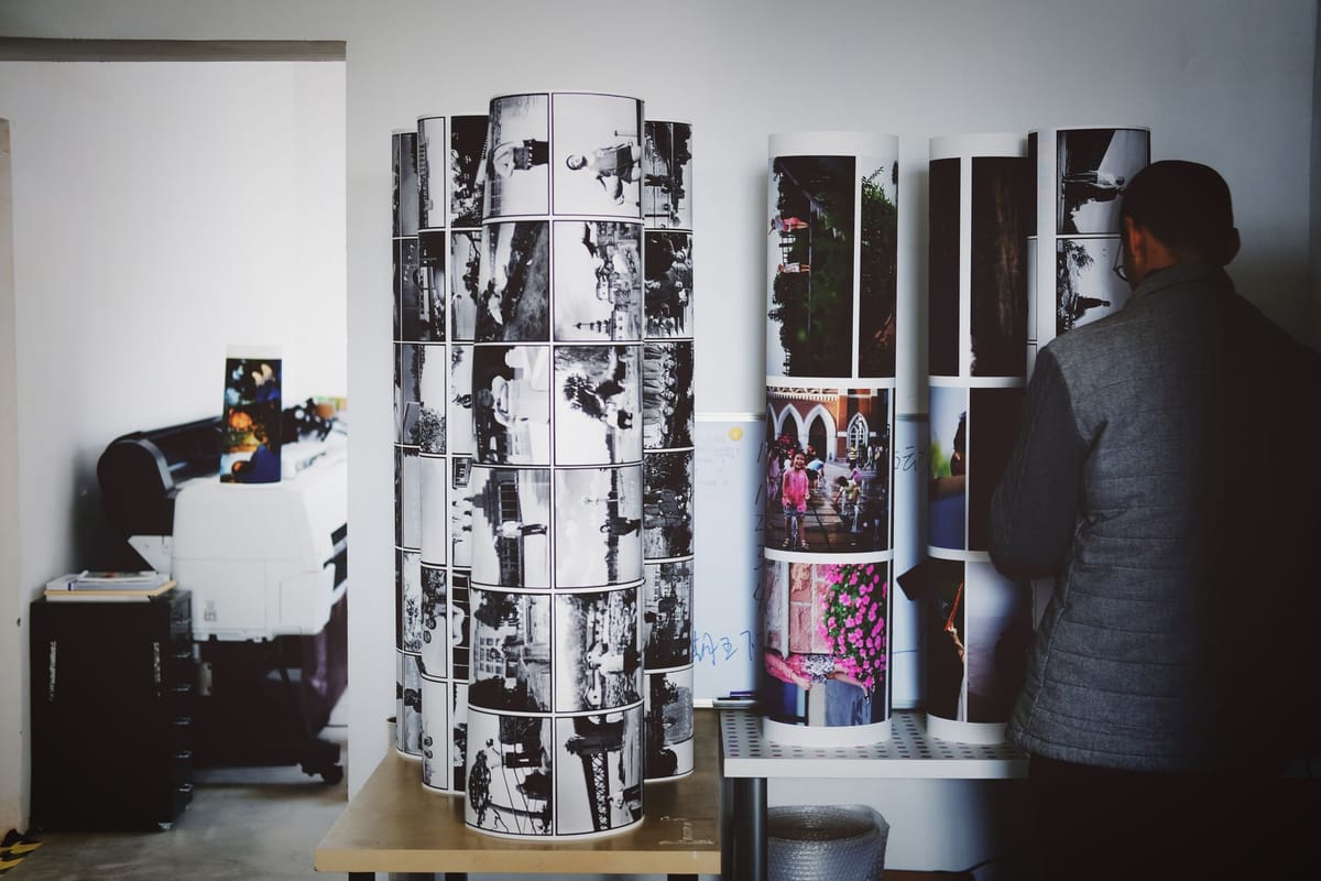Printed banners stacked at a print shop