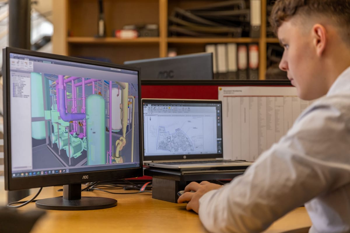 A designer laying out a banner on screen