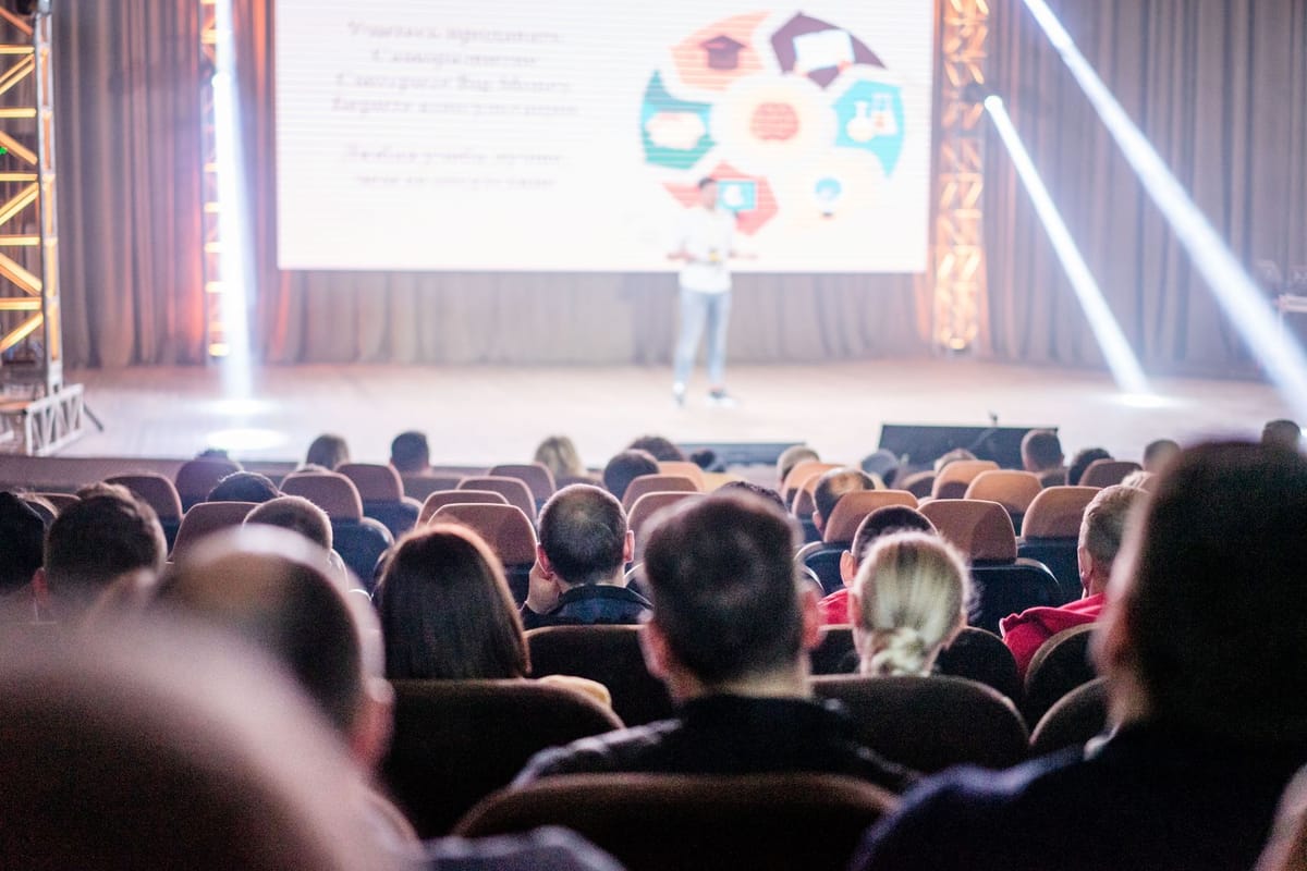A branded stage backdrop at a conference