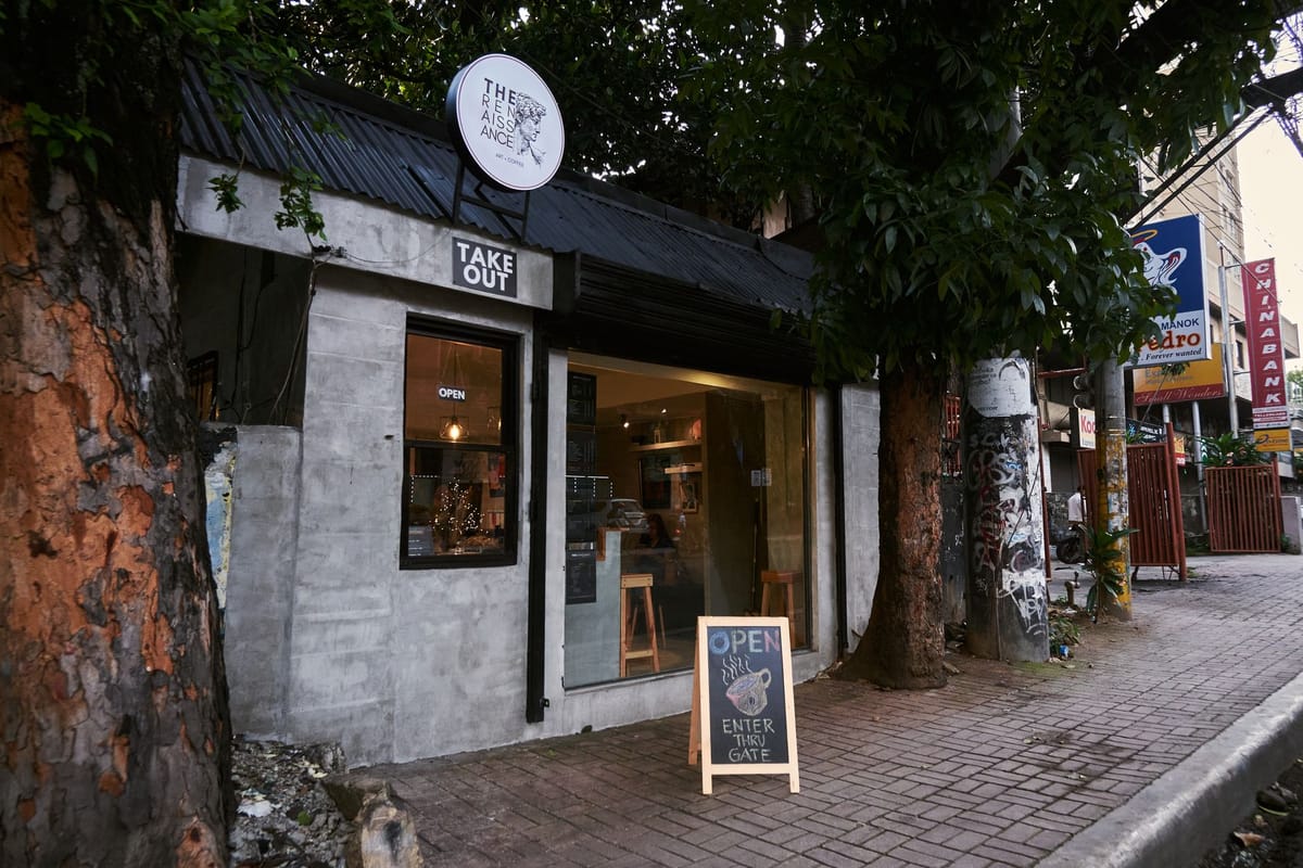 An A-frame sidewalk sign outside a café