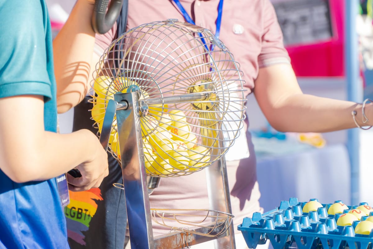 Visitors spinning a branded prize wheel at a booth
