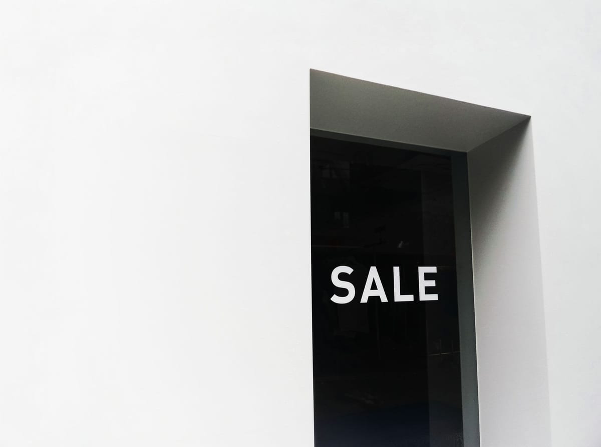Bold red sale signage in a shop window